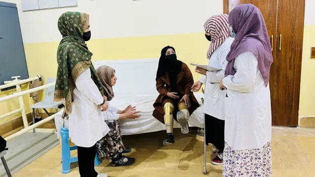 Marzia Hussaini with physiotherapists at the ICRC’s PRC in Mazar-e-Sharif. 