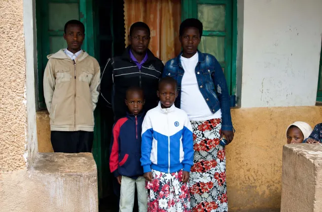 Ntahimpera-Jean-Marie-Eric-stands-with-his-family-in-Burundi