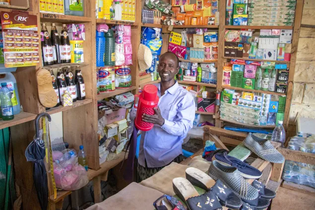 Photo of Hassan, a beneficiary in his shop.