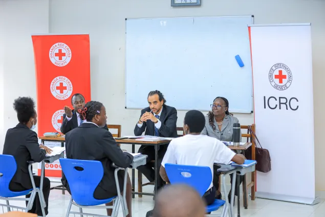 Students of Gulu University during a role play with Judges (L-R) His Worship Paul Kalondo, Mohammed Elserafy ICRC Legal Adviser and Justice Lillian Omara. Photo Credit: Patrick/URCS