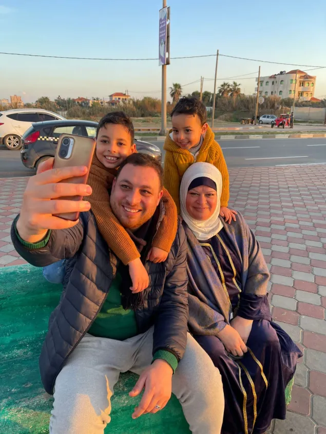 A family photo of Mohanned with his two children and his mother in happier times.
