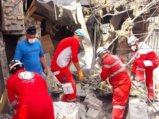 IRCS Rescue and Relief staff at work at the site of a damaged building in a neighborhood of Tehran, 2026. 