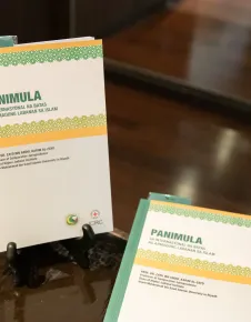 "IHL and Islamic law" book in Tagalog displayed on a desk