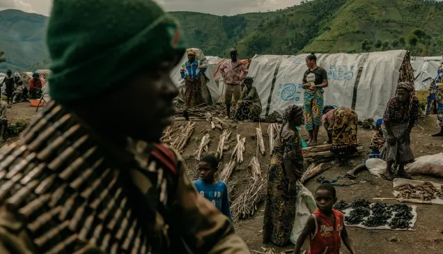 Congolese army units drive past displacement camps. 08 April, Sake, North Kivu Province, Democratic Republic of Congo. Sake was a key objective of an M23 offensive seeking to isolate the city of Goma. 