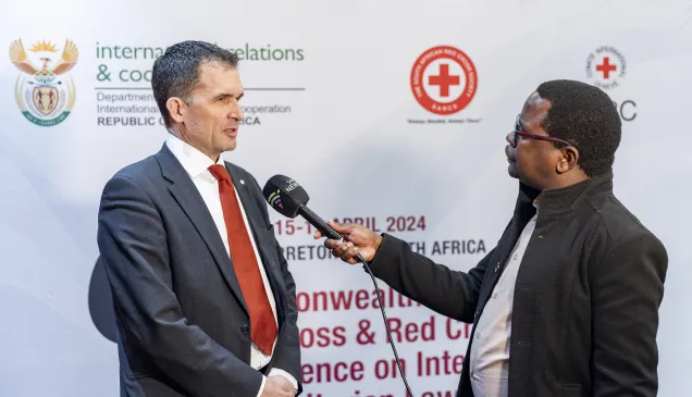 Dr. Niles Melzer, being interviewed at the Conference