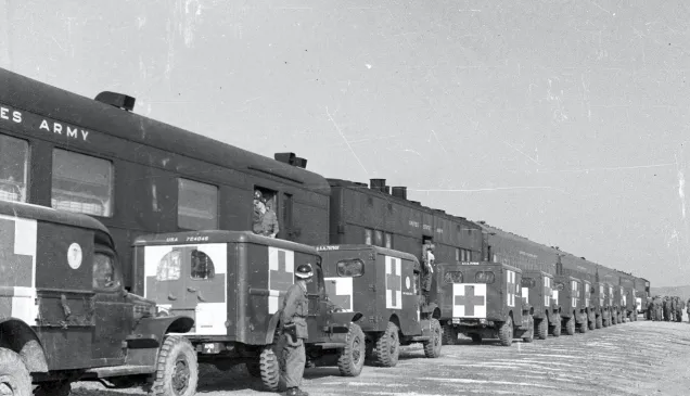 Trains and ambulances awaiting POW exchange in Munsan