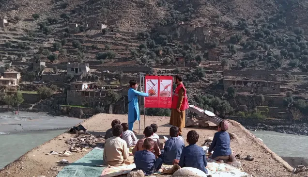 an ARCS volunteer conducts a Risk Awareness Safe Behaviour (RASB) session for children in Kunar province