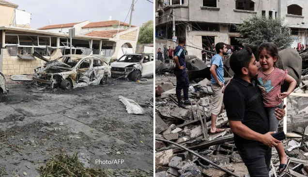 Pessoas estão diante de edifícios destruídos.