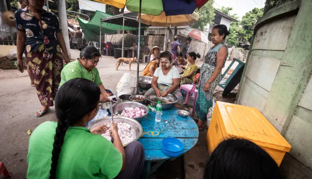 Sagaing, Myanmar, women cooking together in community kitchen 