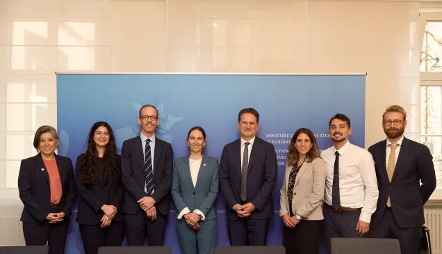 A group photo of eight representatives from the ICRC and Luxembourg MFA.