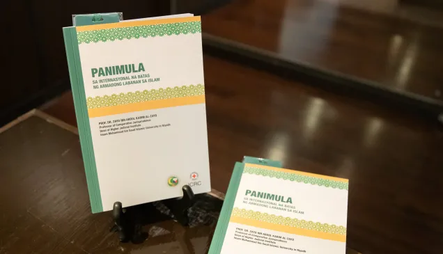 "IHL and Islamic law" book in Tagalog displayed on a desk