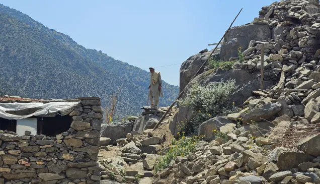 Nurgal district, Kunar province. An old man surveys what is left of the village in the wake of the earthquake in Afghanistan.