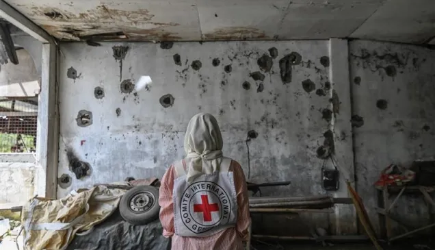 ICRC delegate looks at a bullet-ridden abandoned daycare in Madia, Datu Saudi Ampatuan, Maguindanao del Sur 