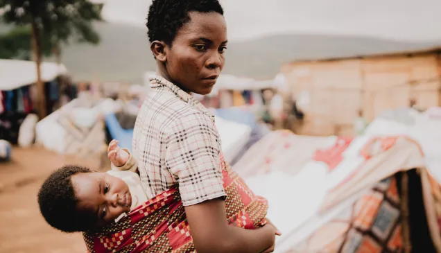 Congolese refugee living in the Busuma camp with her child Promesse.