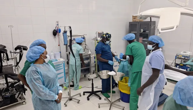 Doctors performing surgery on weapon-wounded patients at the ICRC-supported Juba Military Hospital