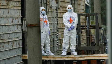 Two ICRC delegates in protective clothing