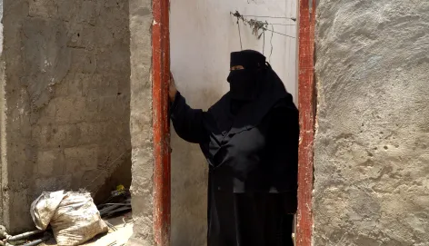 Arwaa stands in the doorway