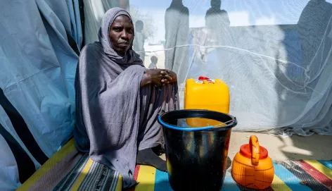 Hawa Adam Abdallah Charfadine, 35 (centre), collected water from a borehole installed by the ICRC near the Tiné transit site, Wadi Fira, Chad.