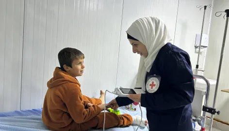 Hasakeh Governorate, Al-Hol camp, hospital. Hamzah, 8, is being treated for internal foot erosion.