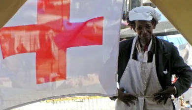 Port-au-Prince. A camp resident looks through the entrance of a first aid post run by the Haitian National Red Cross Society, one of ten set up in Port-au-Prince with support from the ICRC