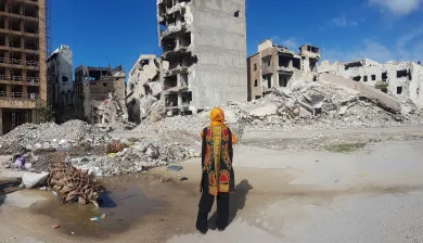 A woman amidst the city ruins after heavy fighting in Benghazi, Libya.
