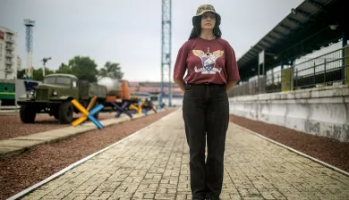Olena Masliuk stands at the train station