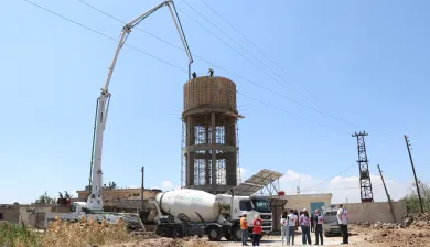 Syria, Qunitera governorate countryside, Ofania town, ICRC, and SARC Wathab teams during the ongoing construction works of the elevated water reservoir project.
