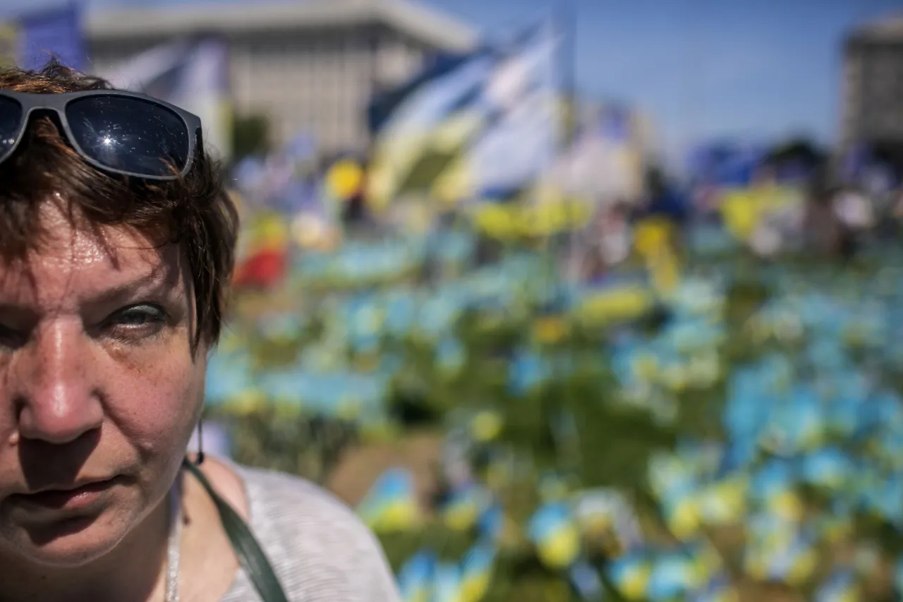 Close-up of Nina's face on a sunny day, with sunglasses on her head