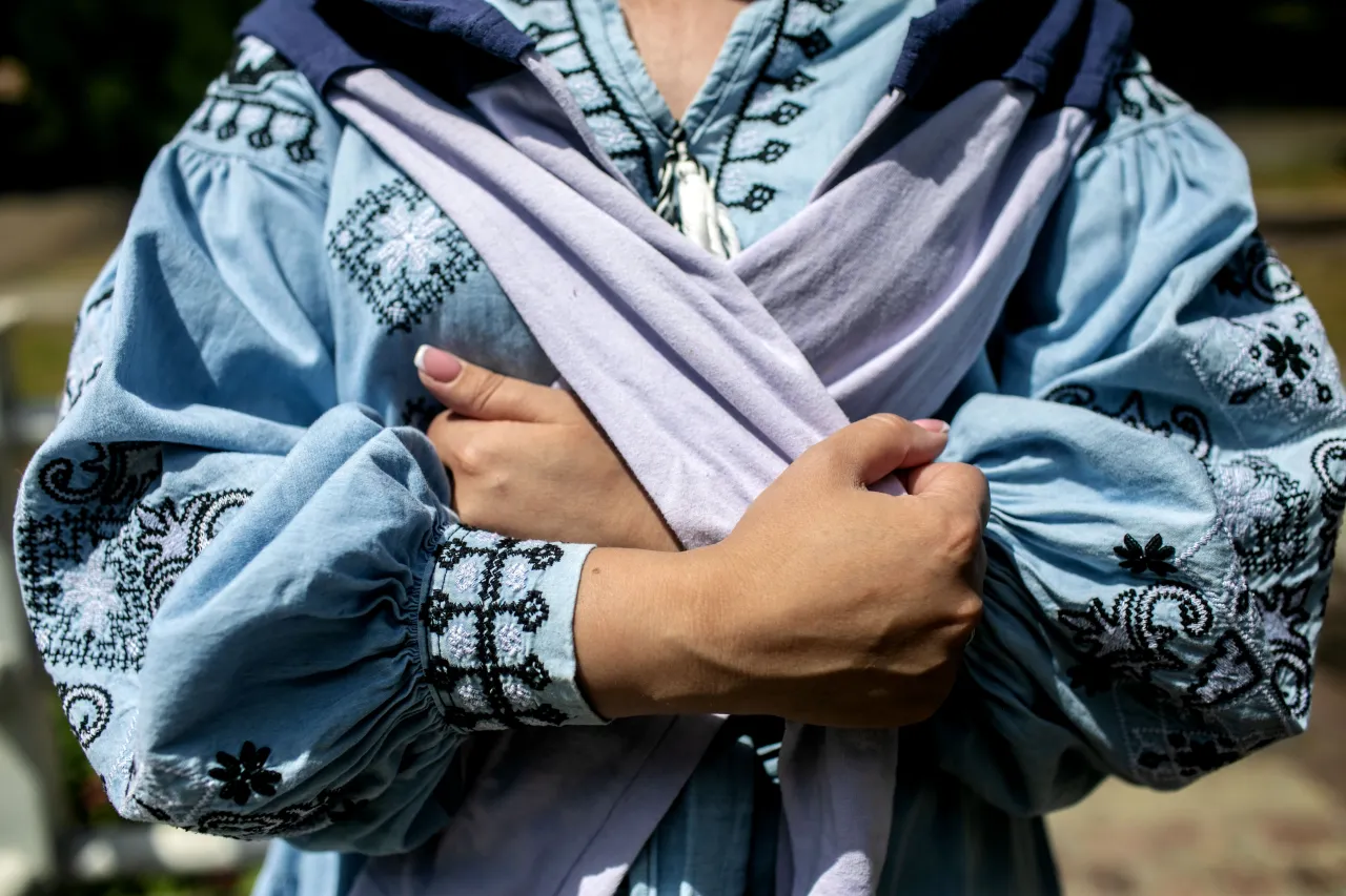 Antonina clutches a sweater belonging to her brother Mykola at the Drevlianskyi Park