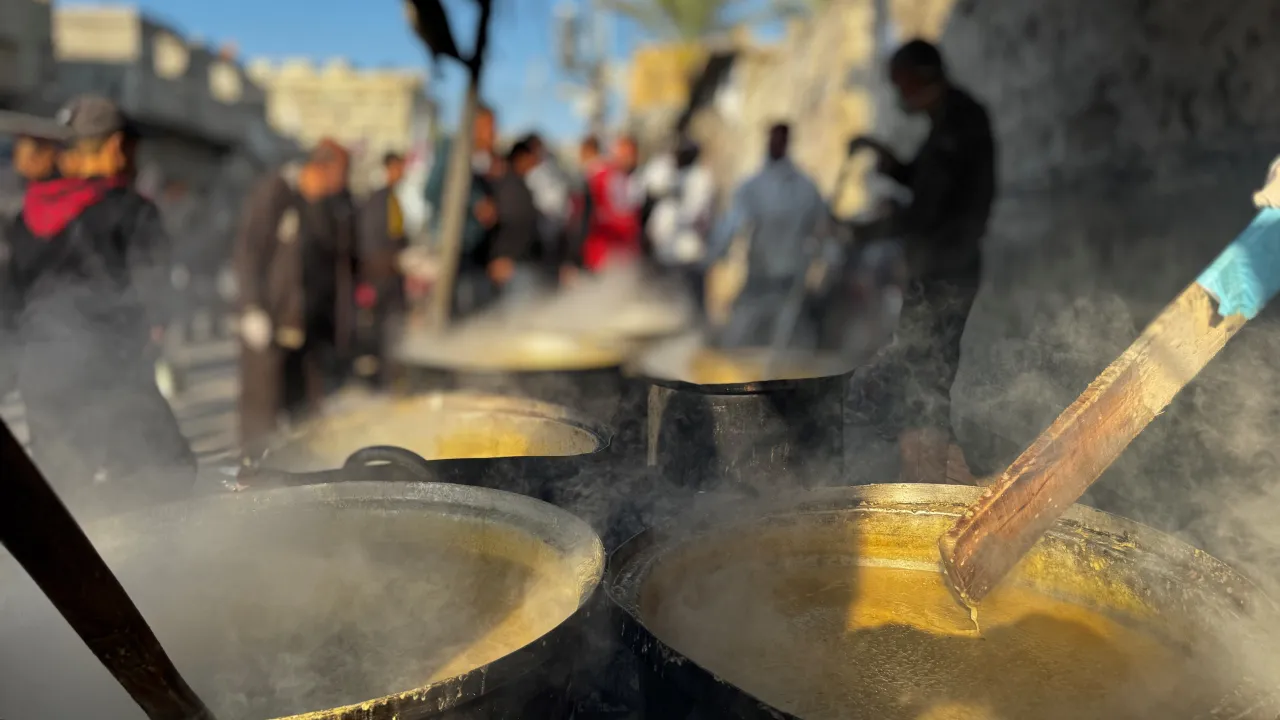 Steaming pots of food in the common kitchen