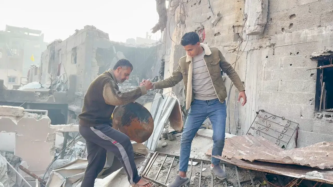 Iyad al-Wahidi returns with his sons to find his home destroyed in Gaza.