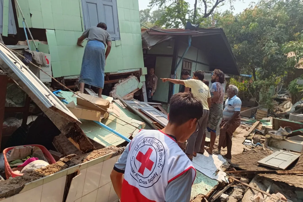 Rescuers work at the site of a collapsed condominium building in Mandalay, central Myanmar