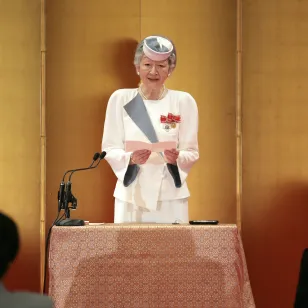Her Majesty Empress Michiko delivers a congratulatory address to Saita, who is about to receive the Florence Nightingale Award, in Japan.