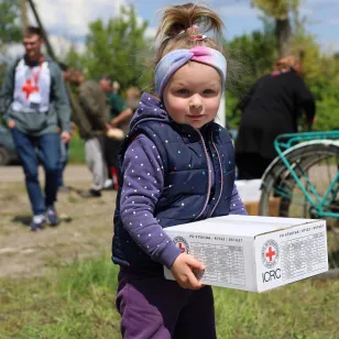 Distributing food supplies and hygiene kits.