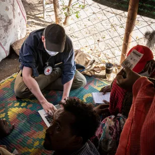 An ICRC delegate speaking to people.