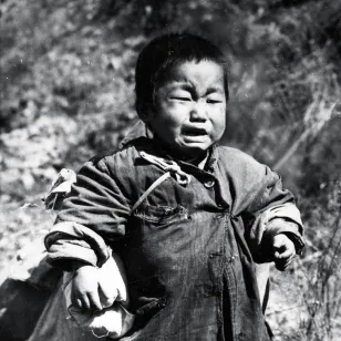 Korean War 1950-1953. Hongchon sector. One of the youngest Korean children found by UN troops on the central front.