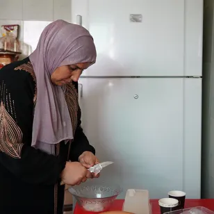 Rosa in the kitchen preparing food