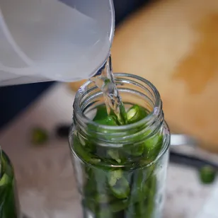 Liquid being poured into a jar