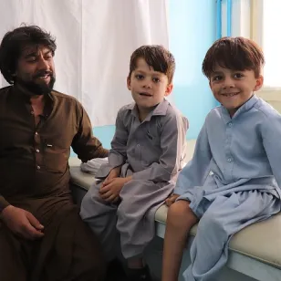 Matiullah with his two sons, Mohabbatuallah (right) and Yusuf (left), at the PRC in Kabul. 