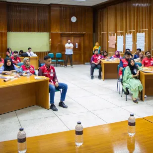 ICRC and Red Crescent Society staff in a classroom 