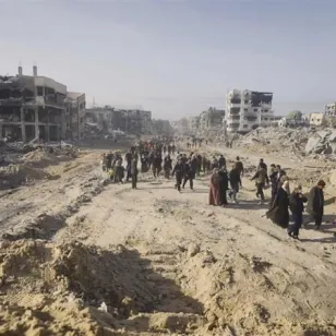 People walking along a dusty road