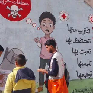  ICRC mural on the walls of a building giving information about unexploded ordinance