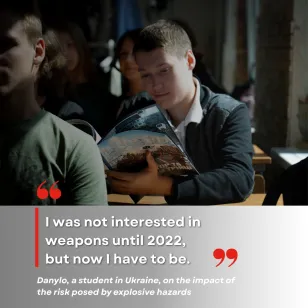 A student reading the comic book on landmine and UXO risk awareness