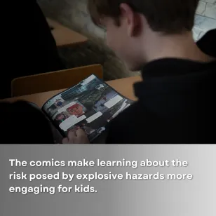 A student reading the comic book on landmine and UXO risk awareness