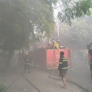 Firefighters in protective gear work to control a fire, in Mandalay, Myanmar, in response to the massive earthquakes which hit the country over the weekend.