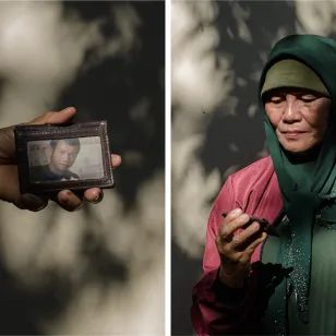 Gloria Berden holding her missing son's wallet