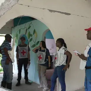 ICRC staff assess damage inside a school in Chocó, Colombia, following an earthquake. 