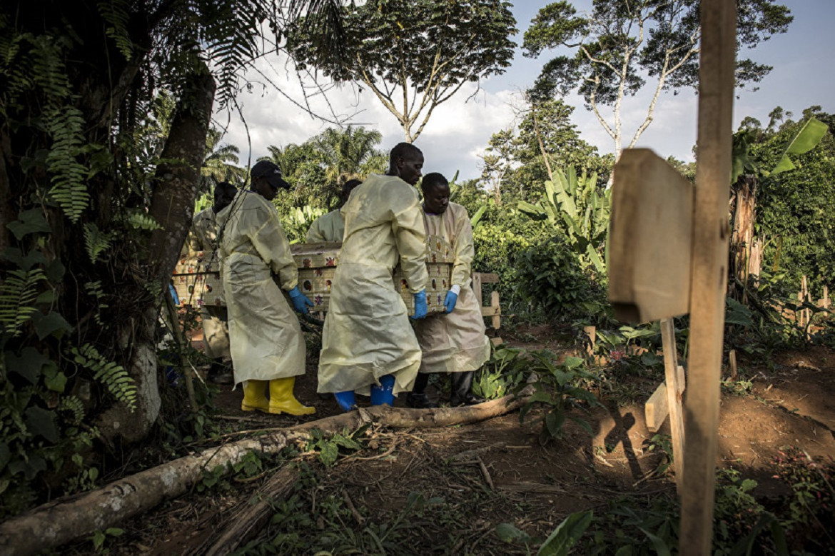 July 15, 2019, Beni. Doctors carry a coffin with the body of one of the dead from Ebola
