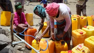 The ICRC reduces suffering by providing clean water, shelter, and essential services, ensuring people affected by armed conflict can live safely.
