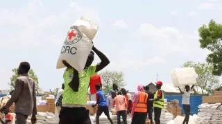 ICRC staff supplying essential items to refugees.